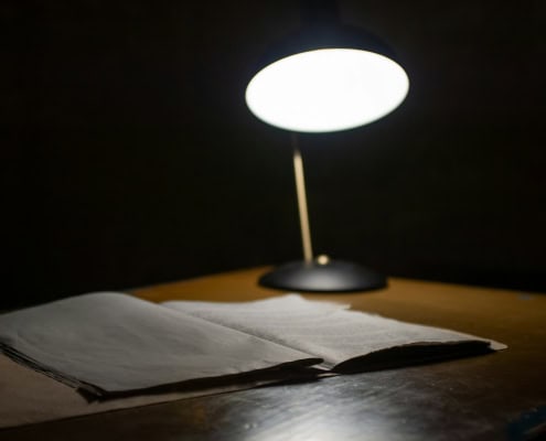 black table lamp beside book