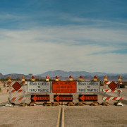 a couple of road signs sitting on the side of a road